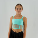 Miętowy top taneczny Corset Glow Mint dla dziewczynki z wstawkami z siatki imitującymi gorset.
