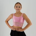 Top taneczny Corset Glow Pink dla dziewczynki w jasnoróżowym kolorze, z lycry z drobinkami brokatu i siatką imitującą gorset.